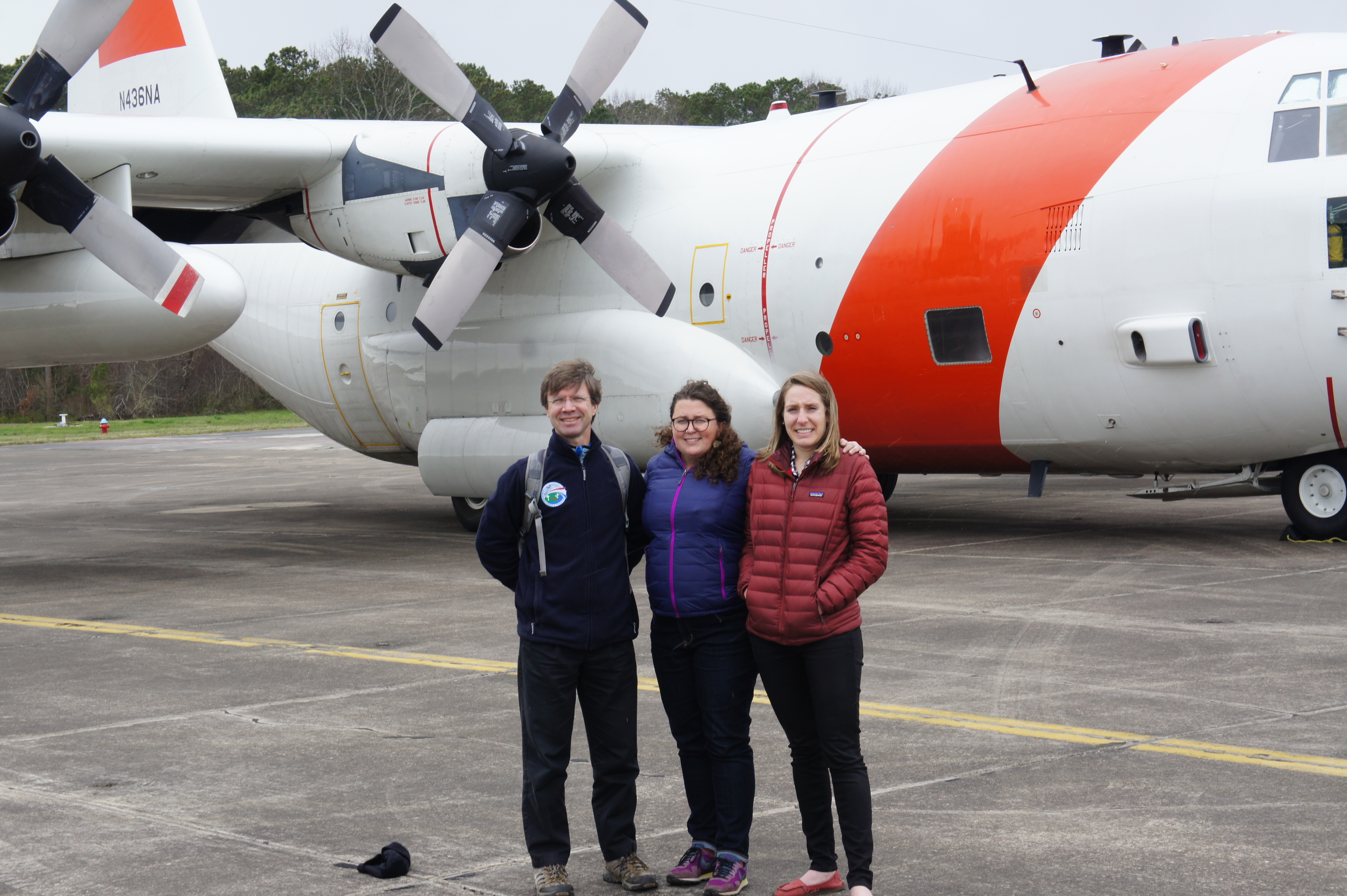 Researchers stand in front of C-130 plane before ACT-America research flight