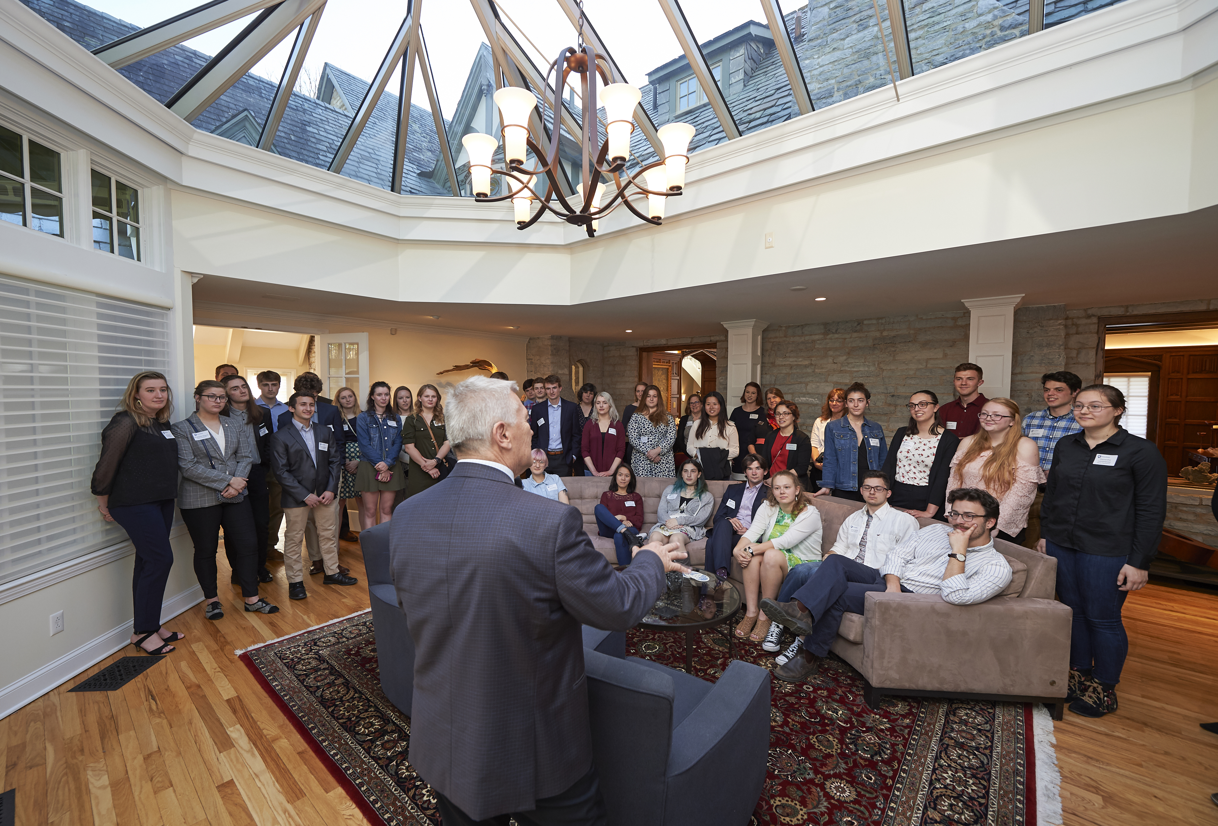 Photograph of Eric Barron addressing a room full of students