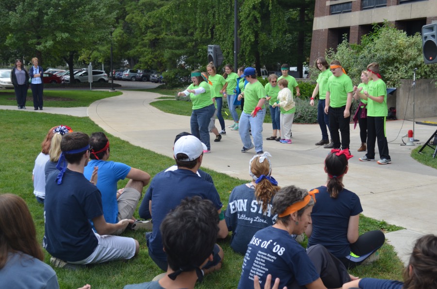 Members of the For Good Troupe dance in front of workshop participants.