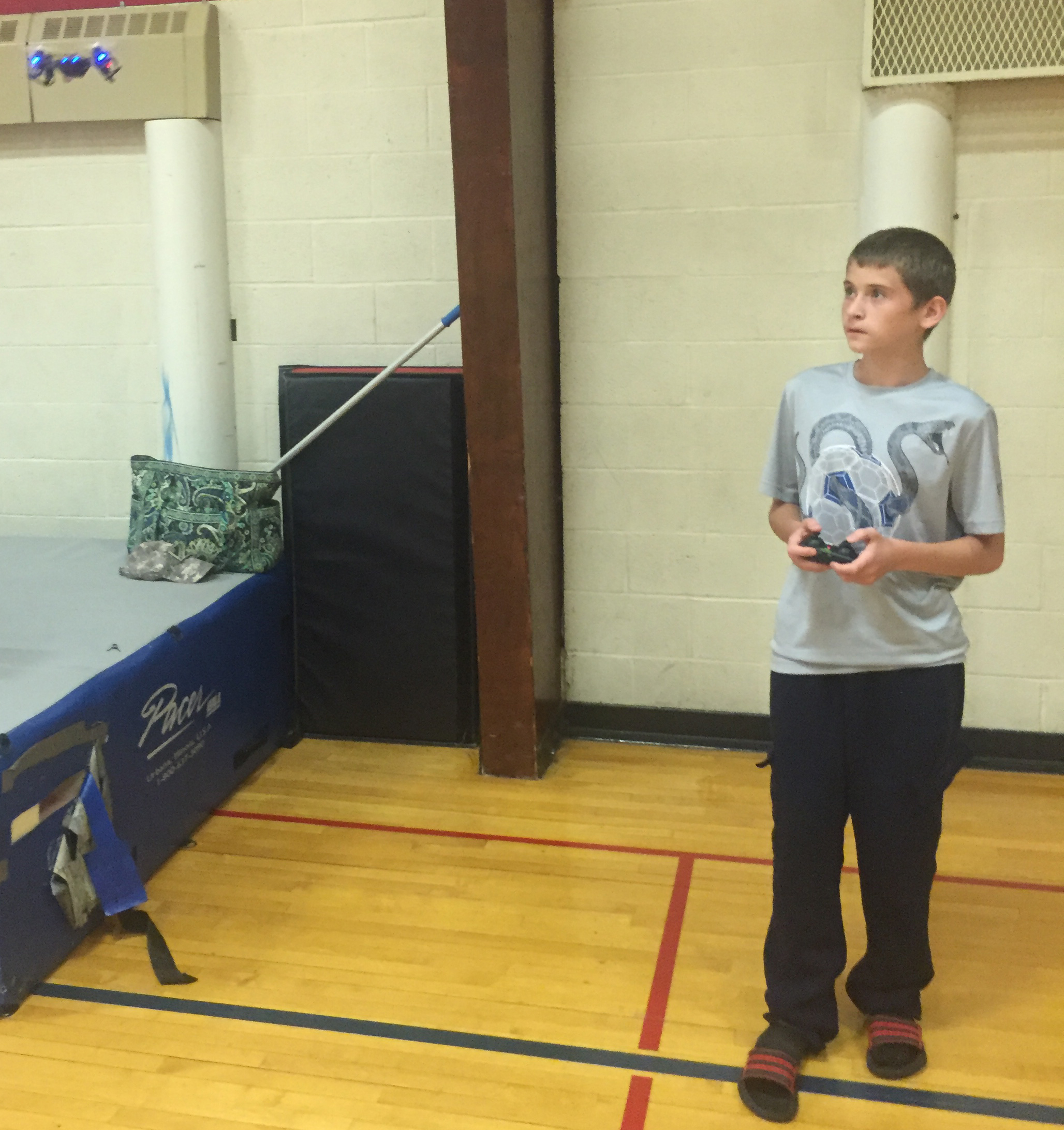 Donald Feathers maneuvers a Dromida KODU Quadcopter within Erie Hall. 