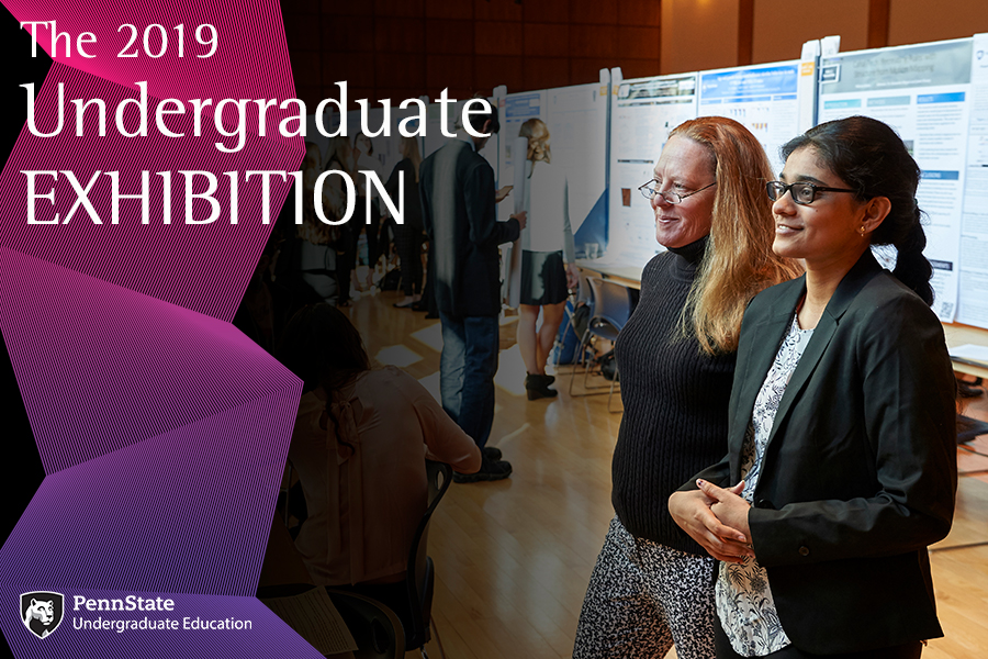 Judges view student posters at the Undergraduate Exhibition