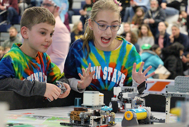 Smart Software team members Ryan Avram and Caylyn Hauser present their robot during the tournament.