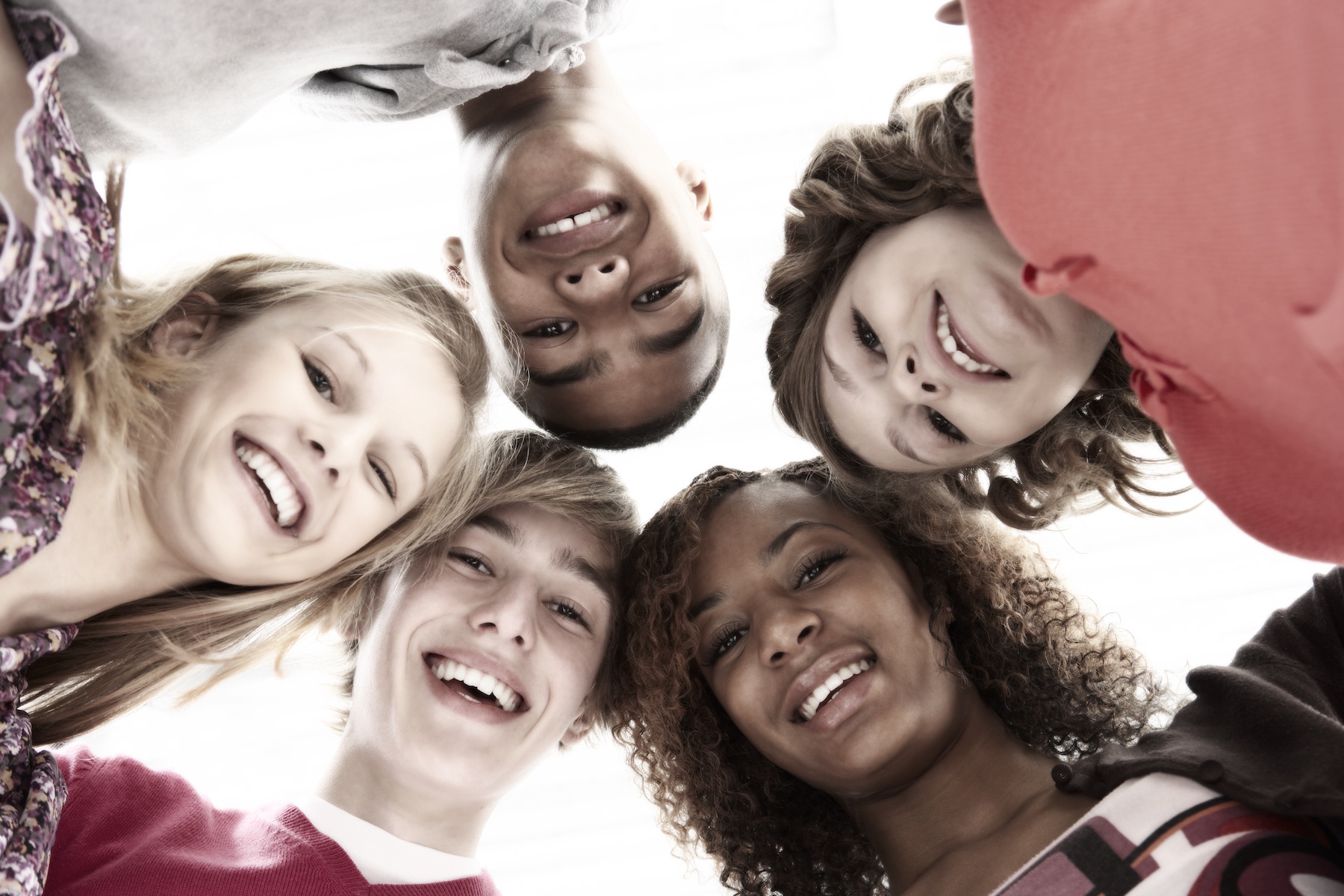 Five Teenage Friends Looking Down Into Camera