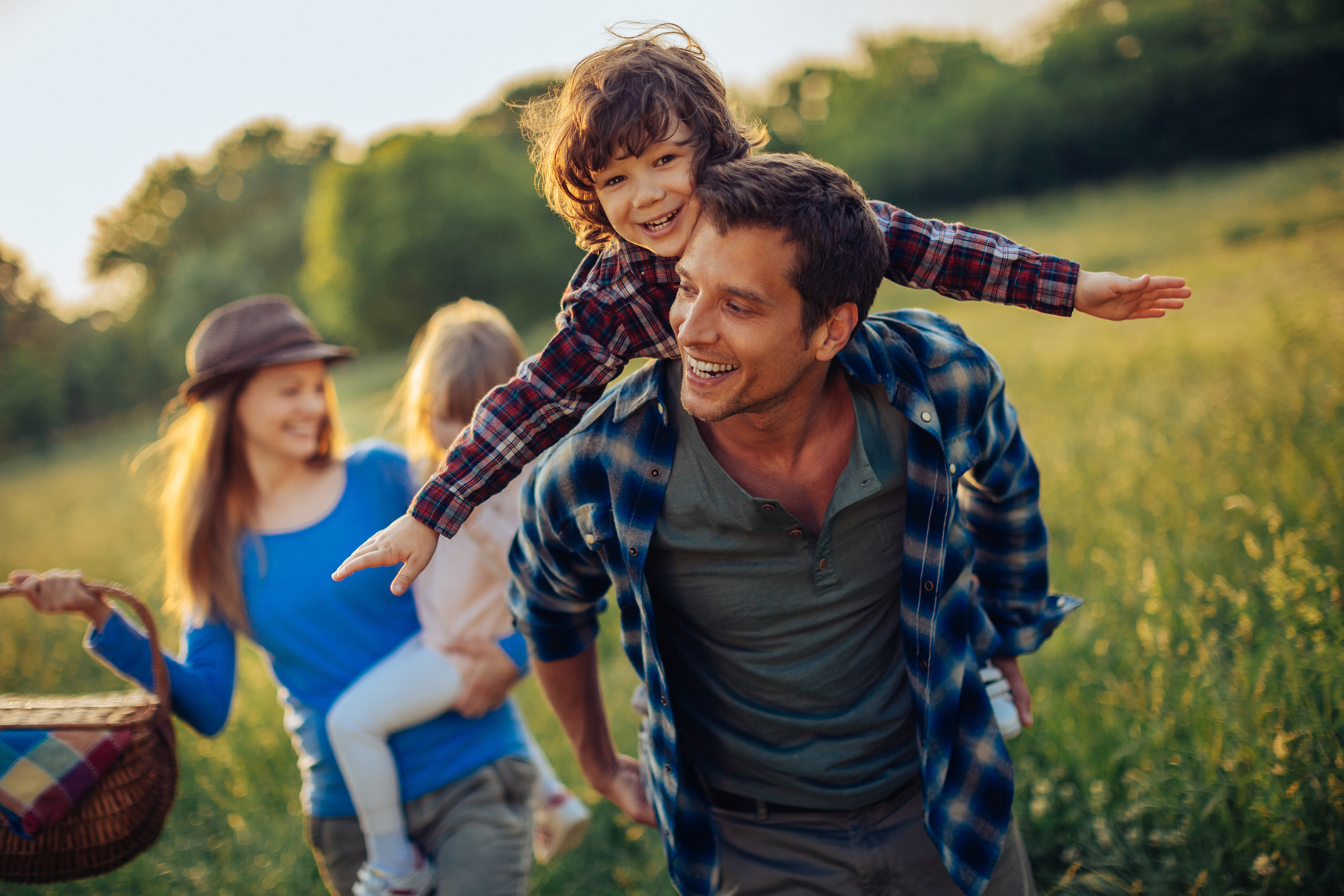 Man with family in field