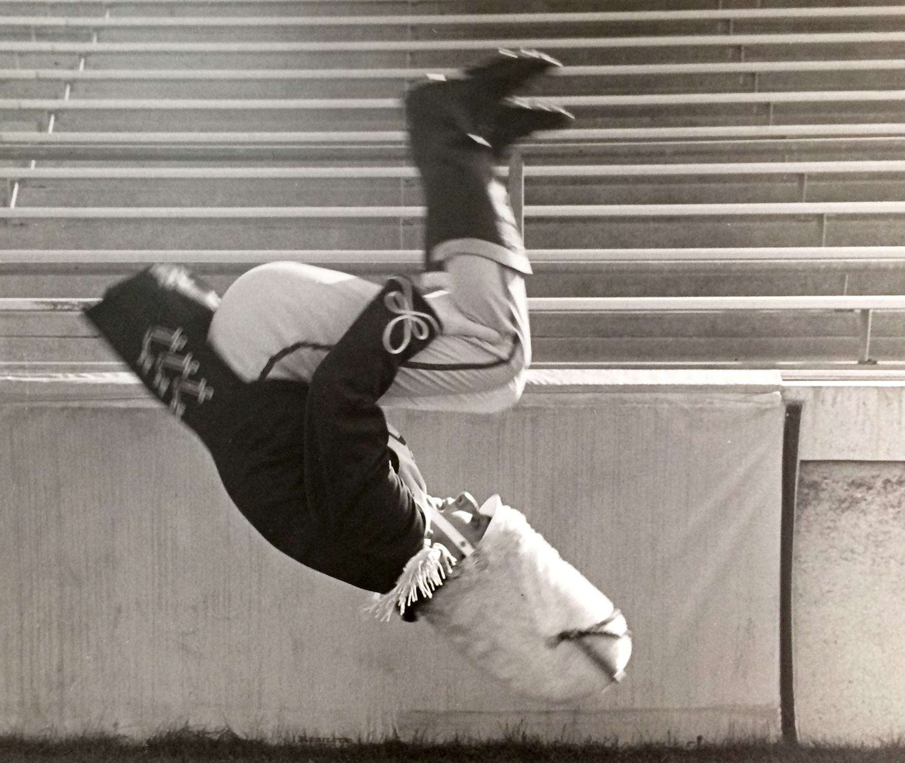 Richard Gorodesky, in Blue Band uniform, mid-air performing a flip