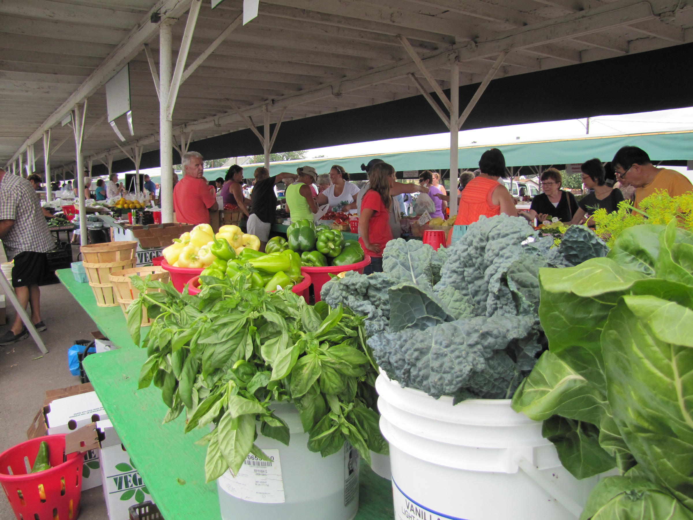 leafy produce at market booth