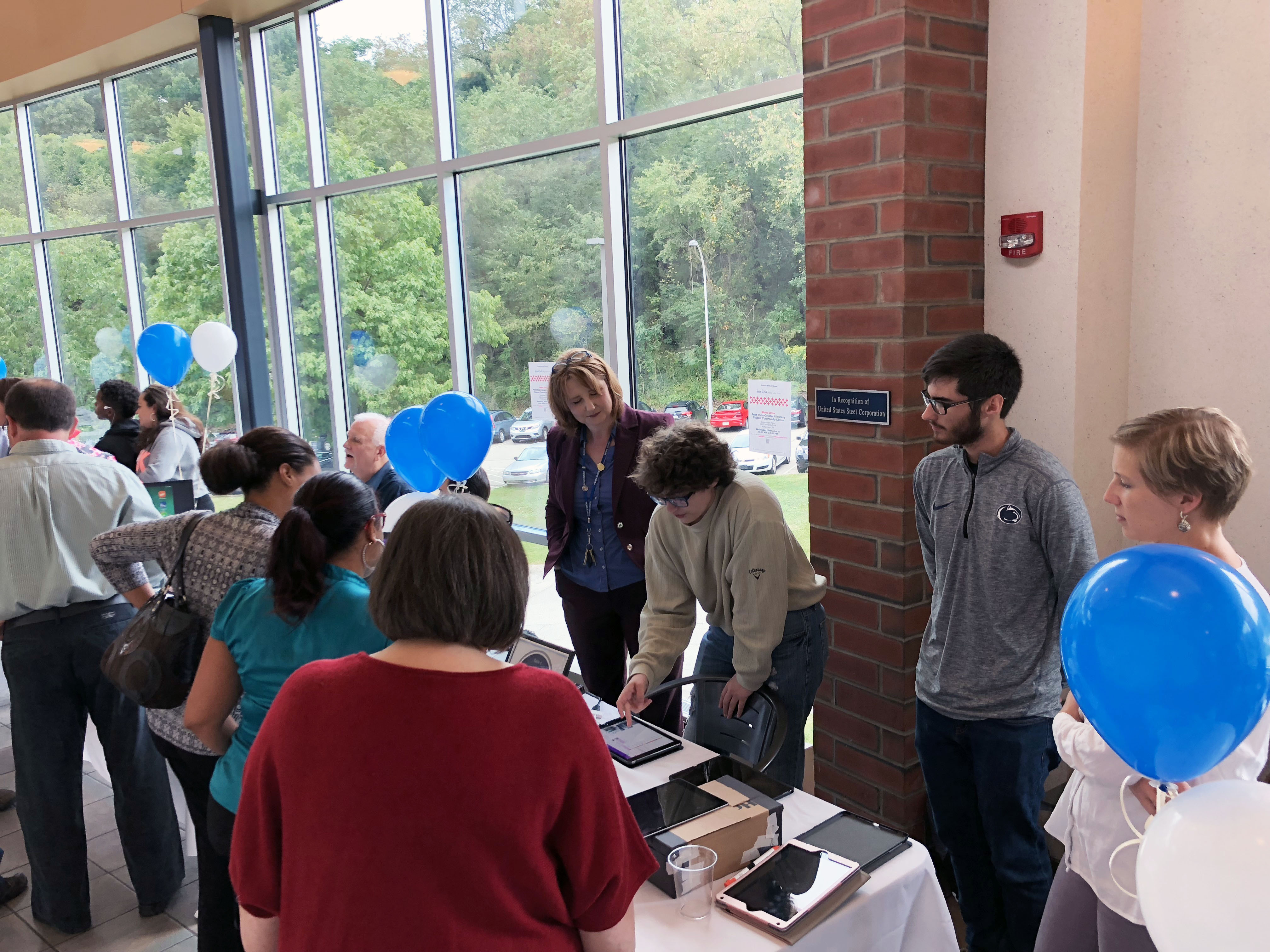 Students, Faculty, and Staff demonstrating how they are utilizing iPads in their curriculum. 