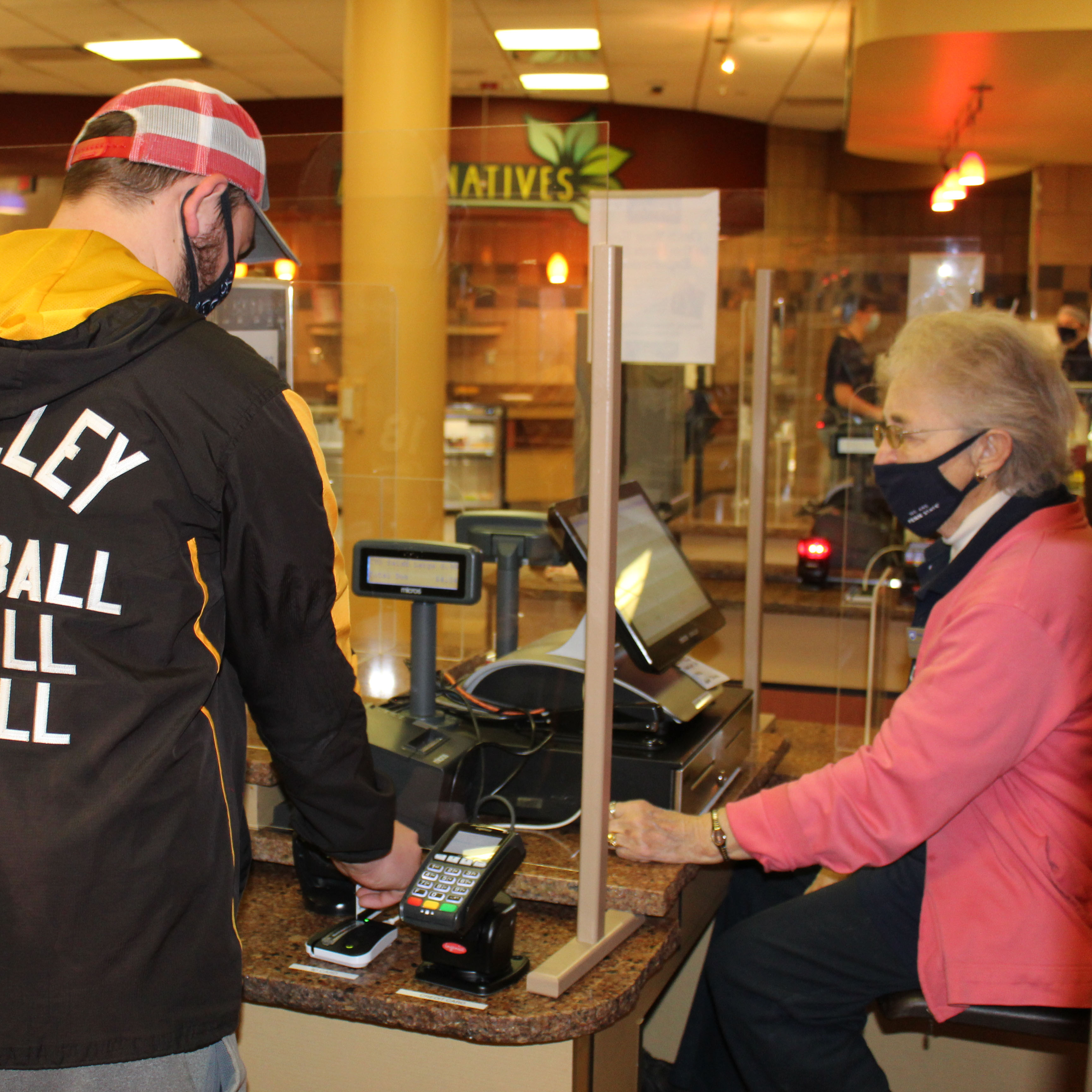 Port Sky cashier Theresa "Terry" Karcz helps a Penn State Altoona student "swipe out hunger" 