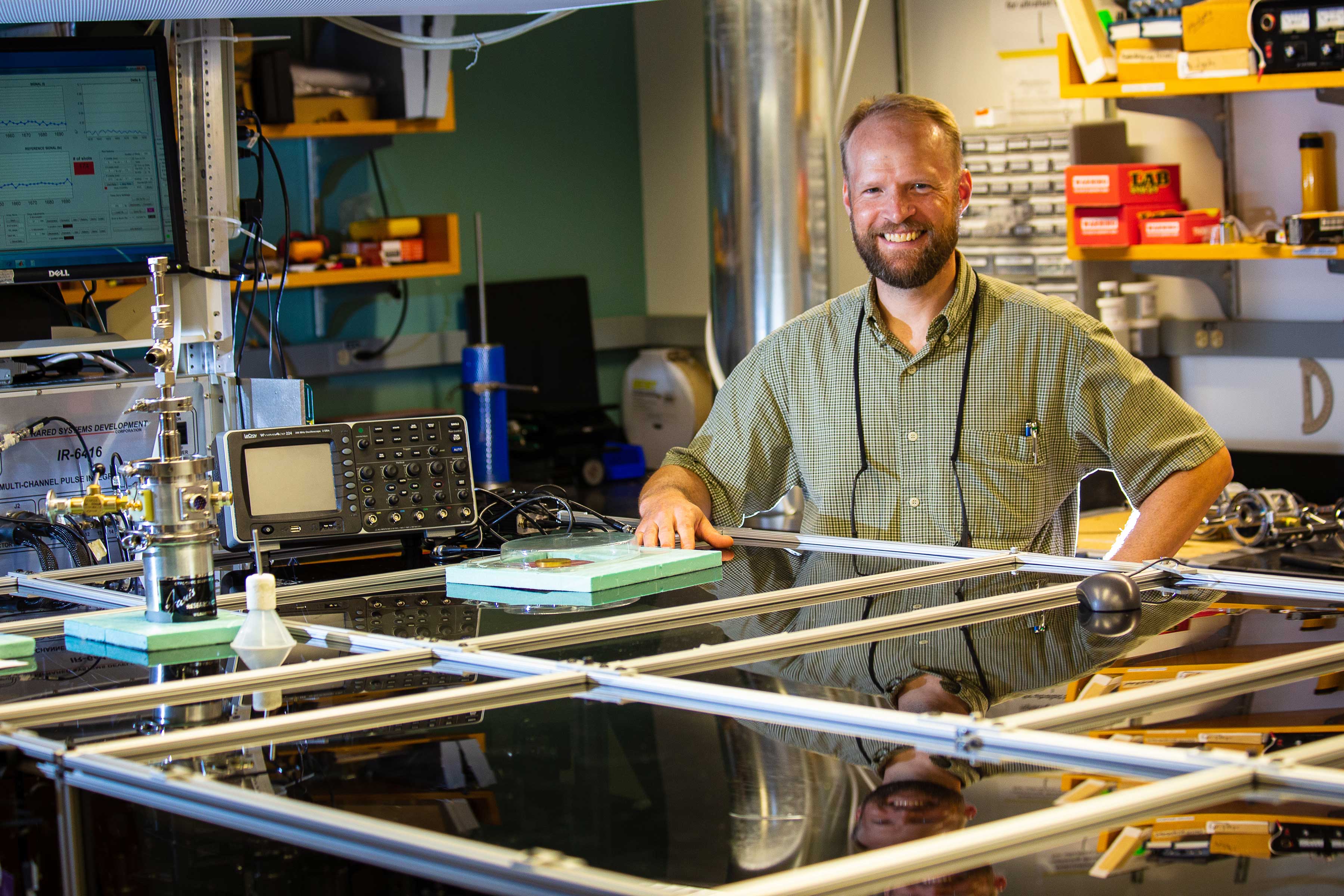 John Asbury behind laboratory equipment