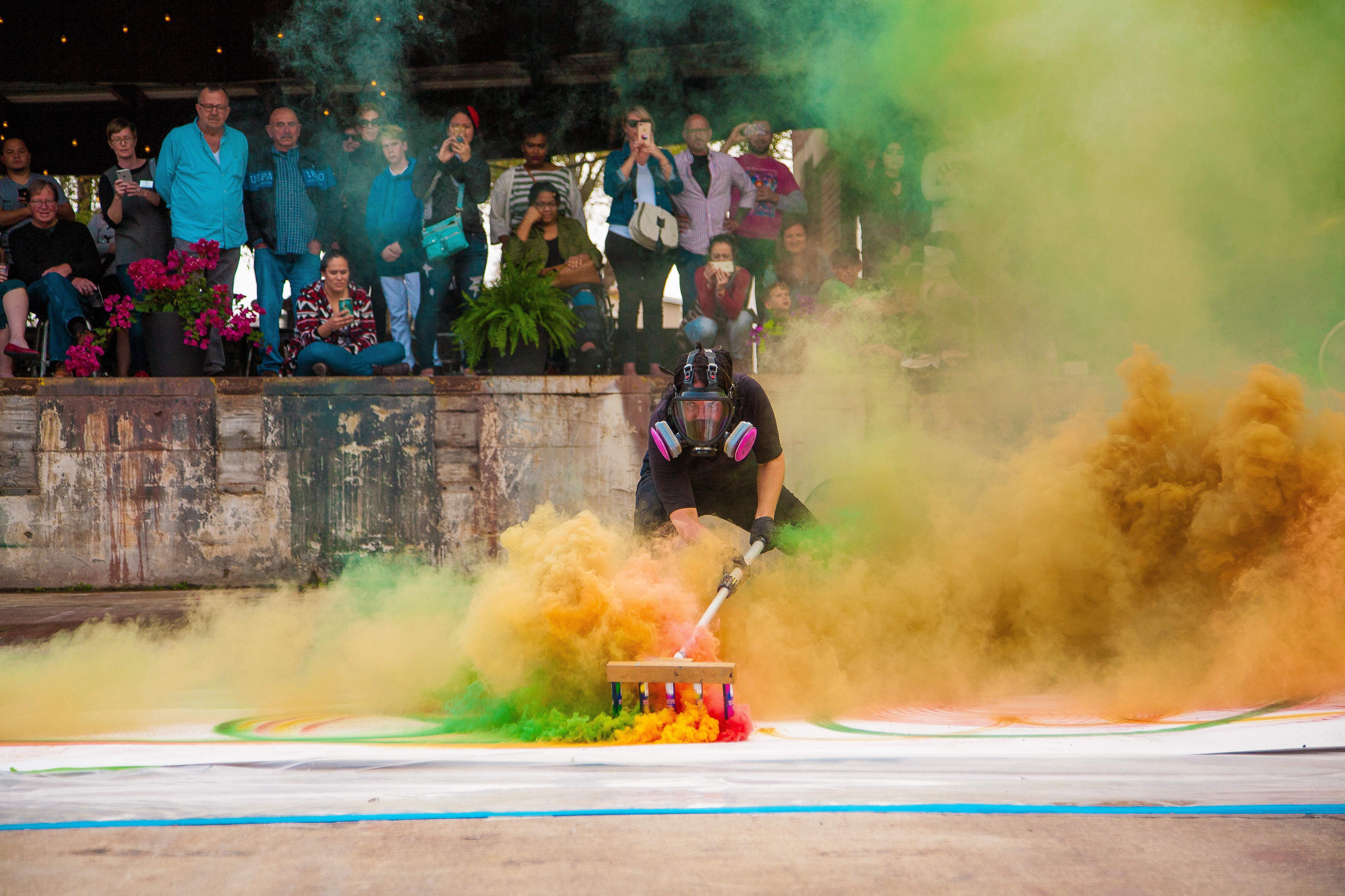 Artist surrounded by colorful smoke