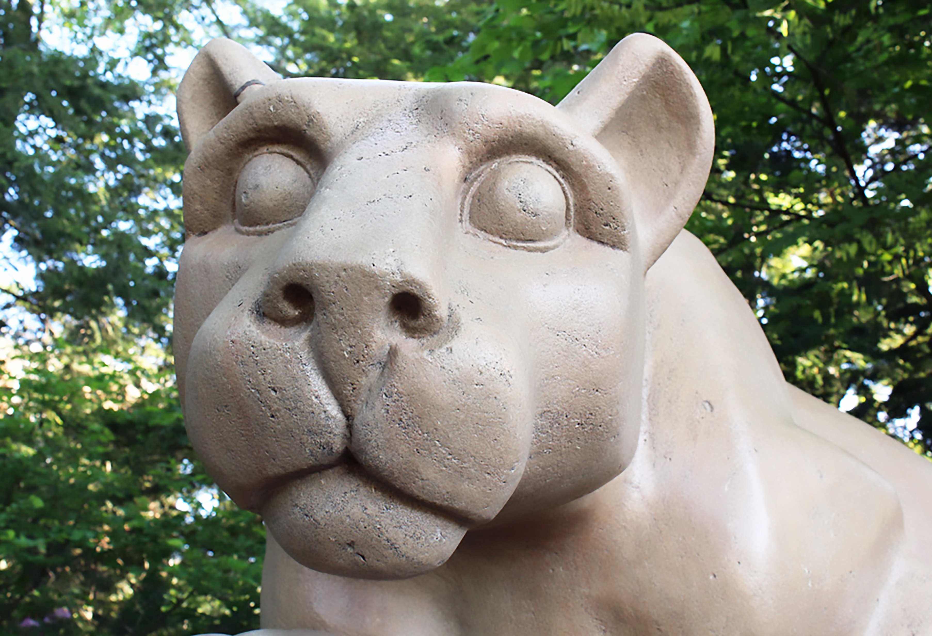 A closeup of the face of Penn State's Nittany Lion statue.