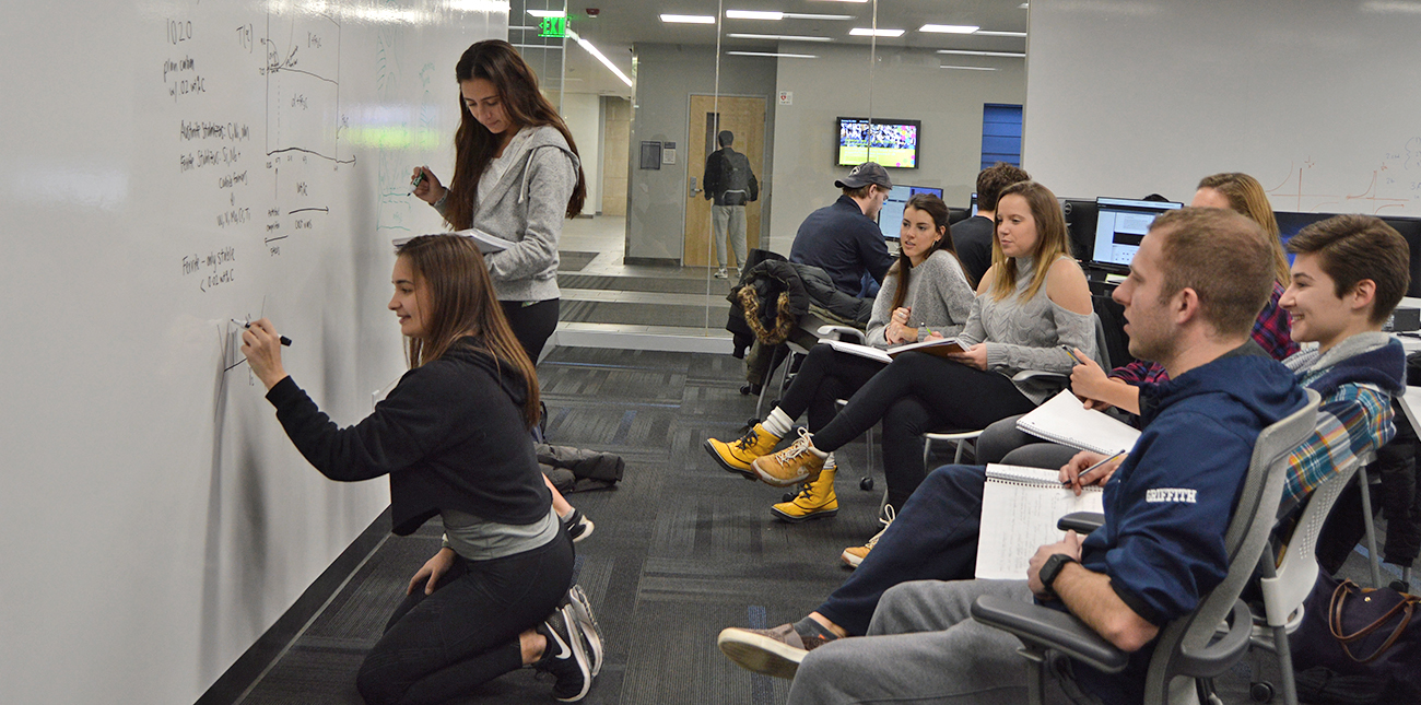 students study at whiteboard wall