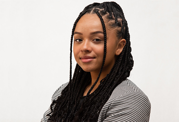 A headshot of a woman in front of a white background. 