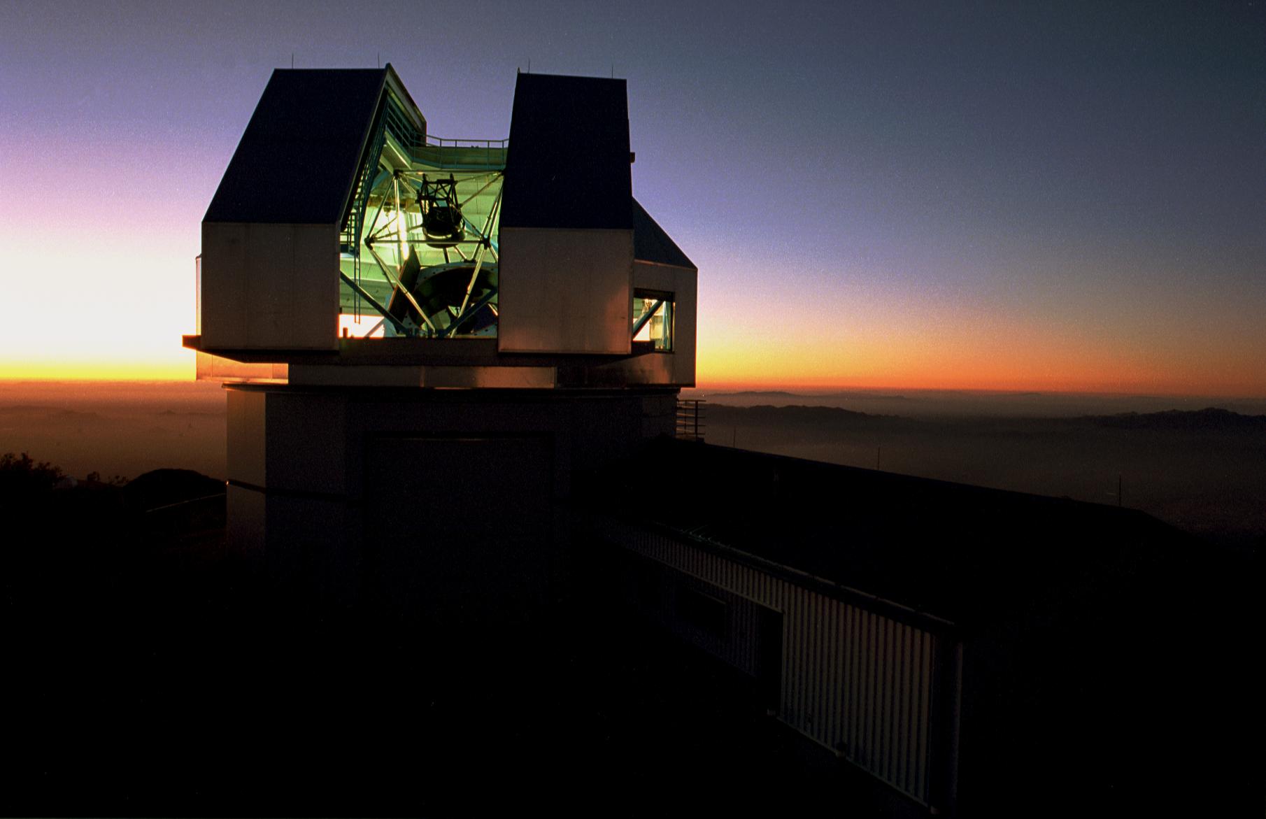 The WIYN telescope building at sunset.