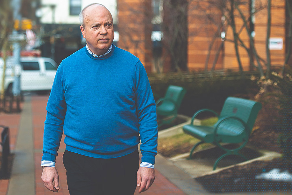 Penn State's Tom Sharbaugh walks in downtown State College.