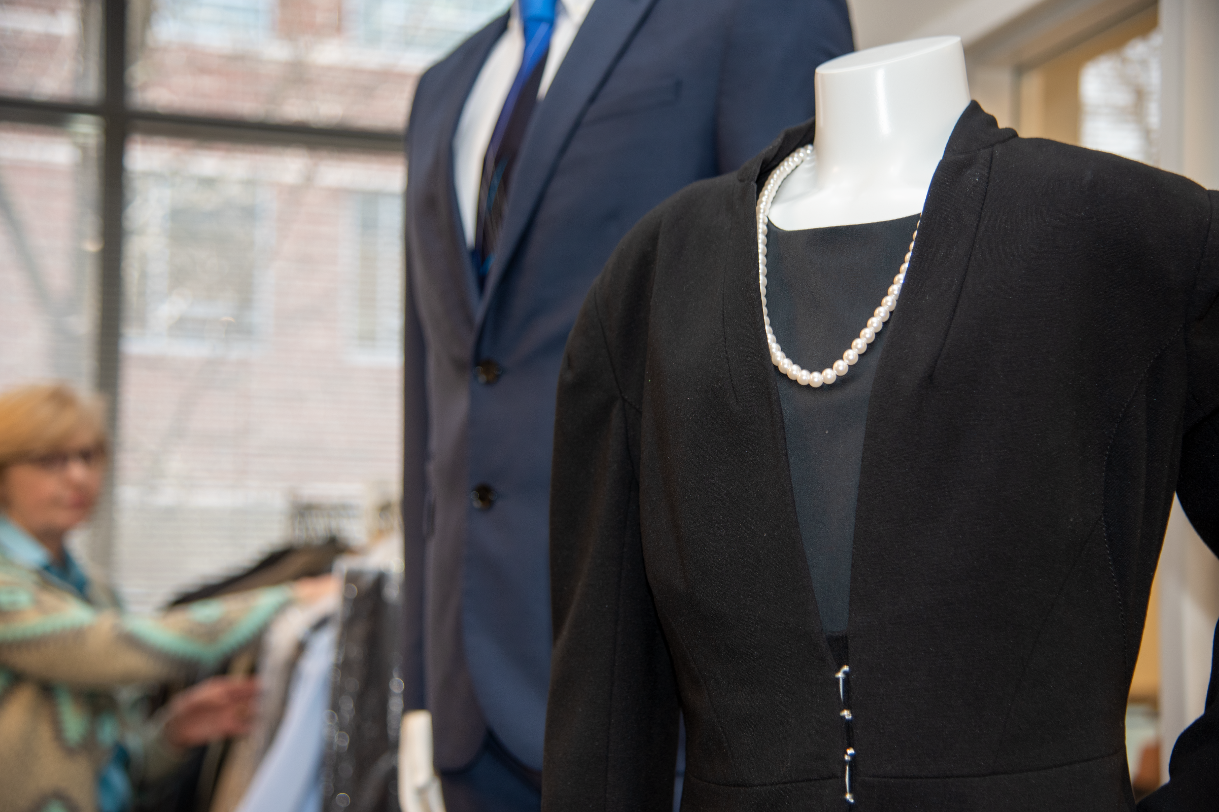 Suits on display at the Professional Attire Closet