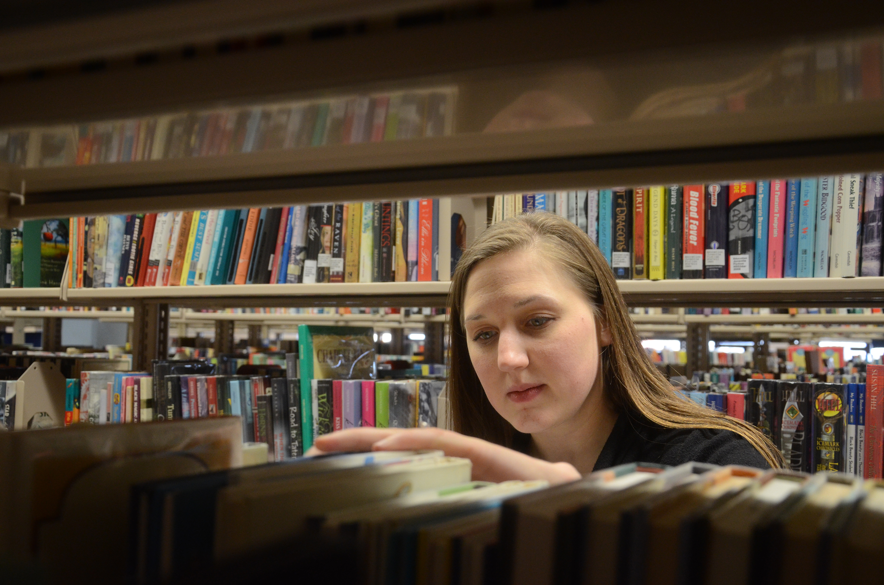 Searching through books at the library