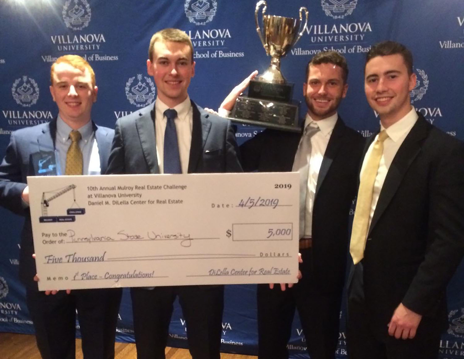 A photo of four Smeal seniors who won a real estate case competition.