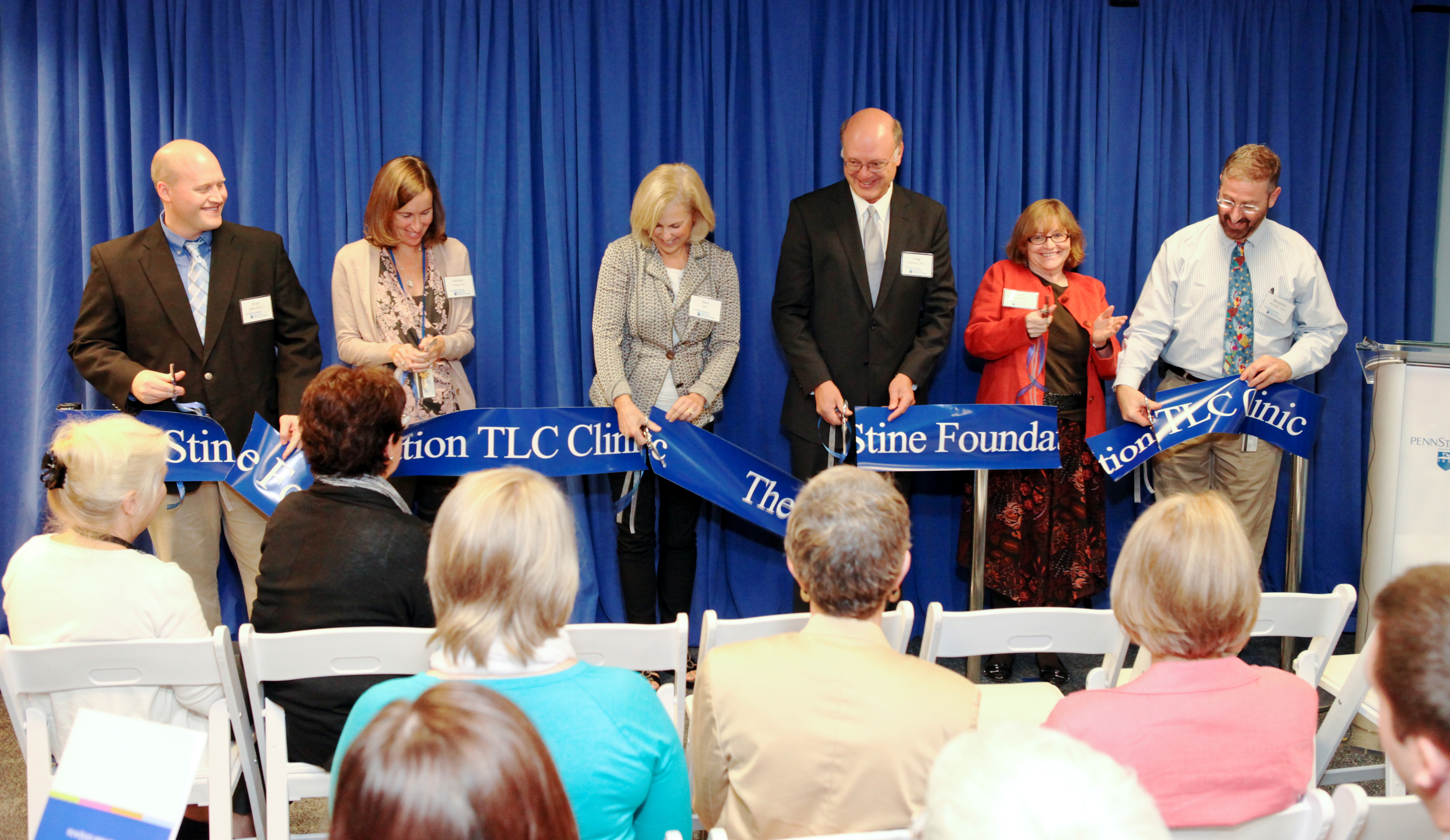 A ribbon is cut marking the grand opening of the James M. and Margaret V. Stine Foundation TLC Clinic, a service of the Penn State Hershey Center for the Protection of Children.