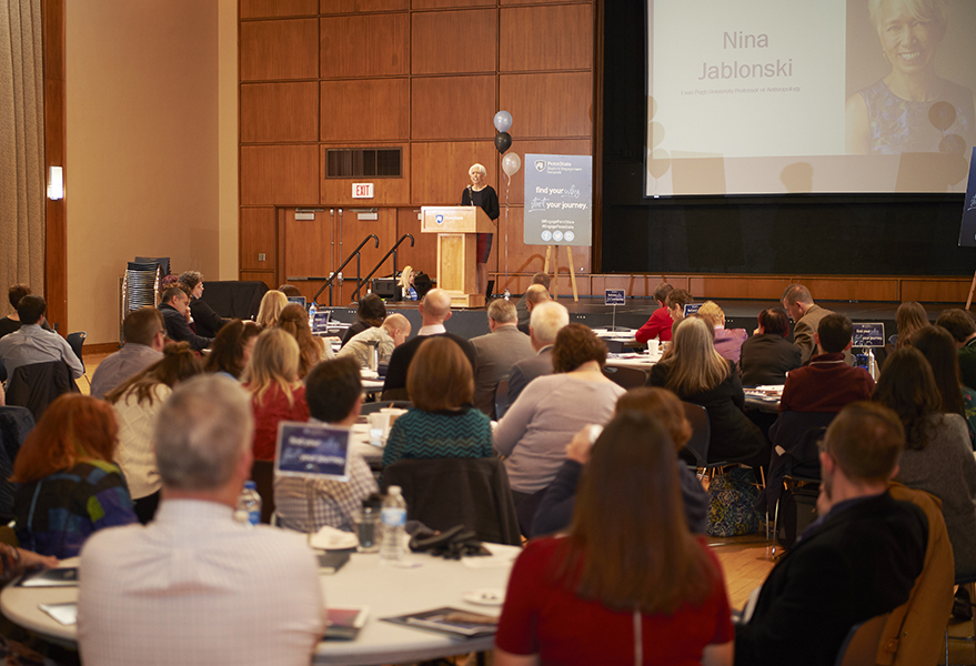 Faculty listen to speaker at engagement summit