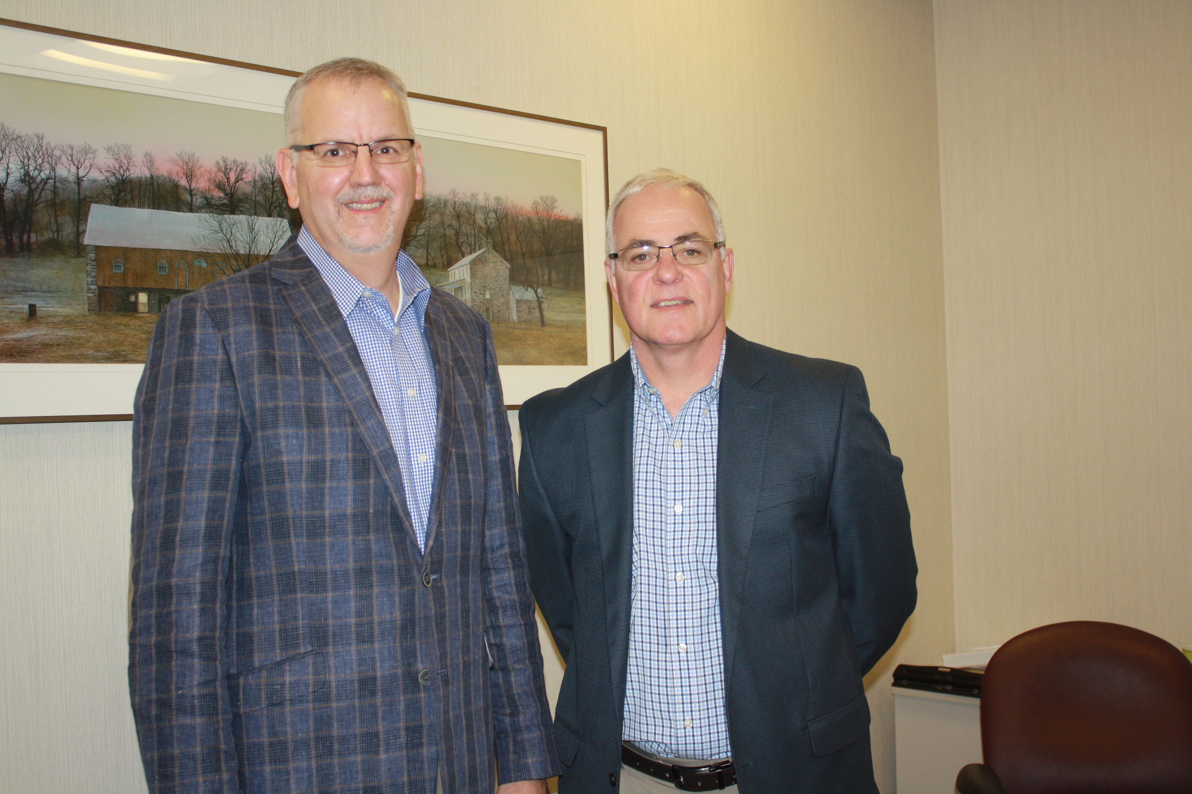 Mike Nesbit, vice president and personal lines manager, at left, with George Heigel, president. 