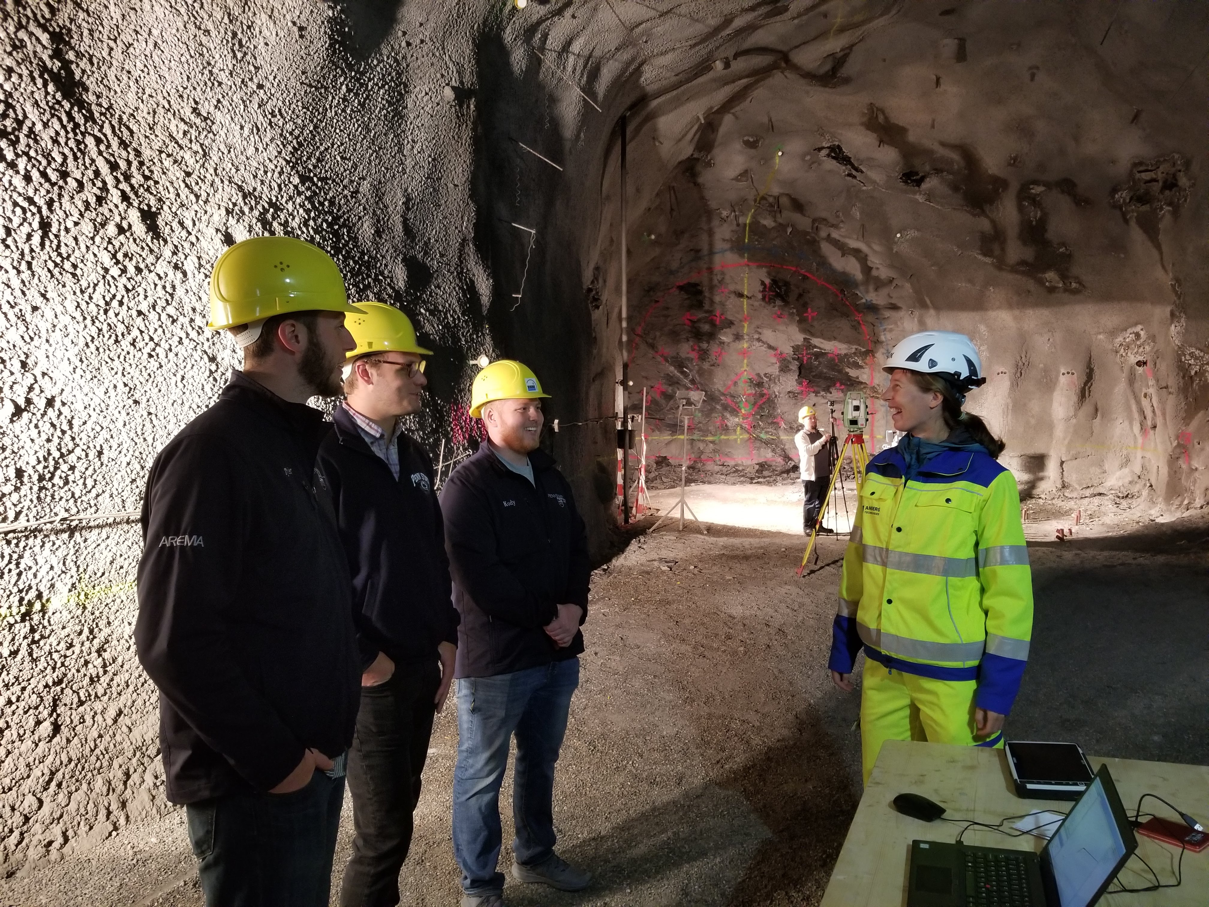 Students and Joe Scott speak with engineer before working on 360-degree video in Europe