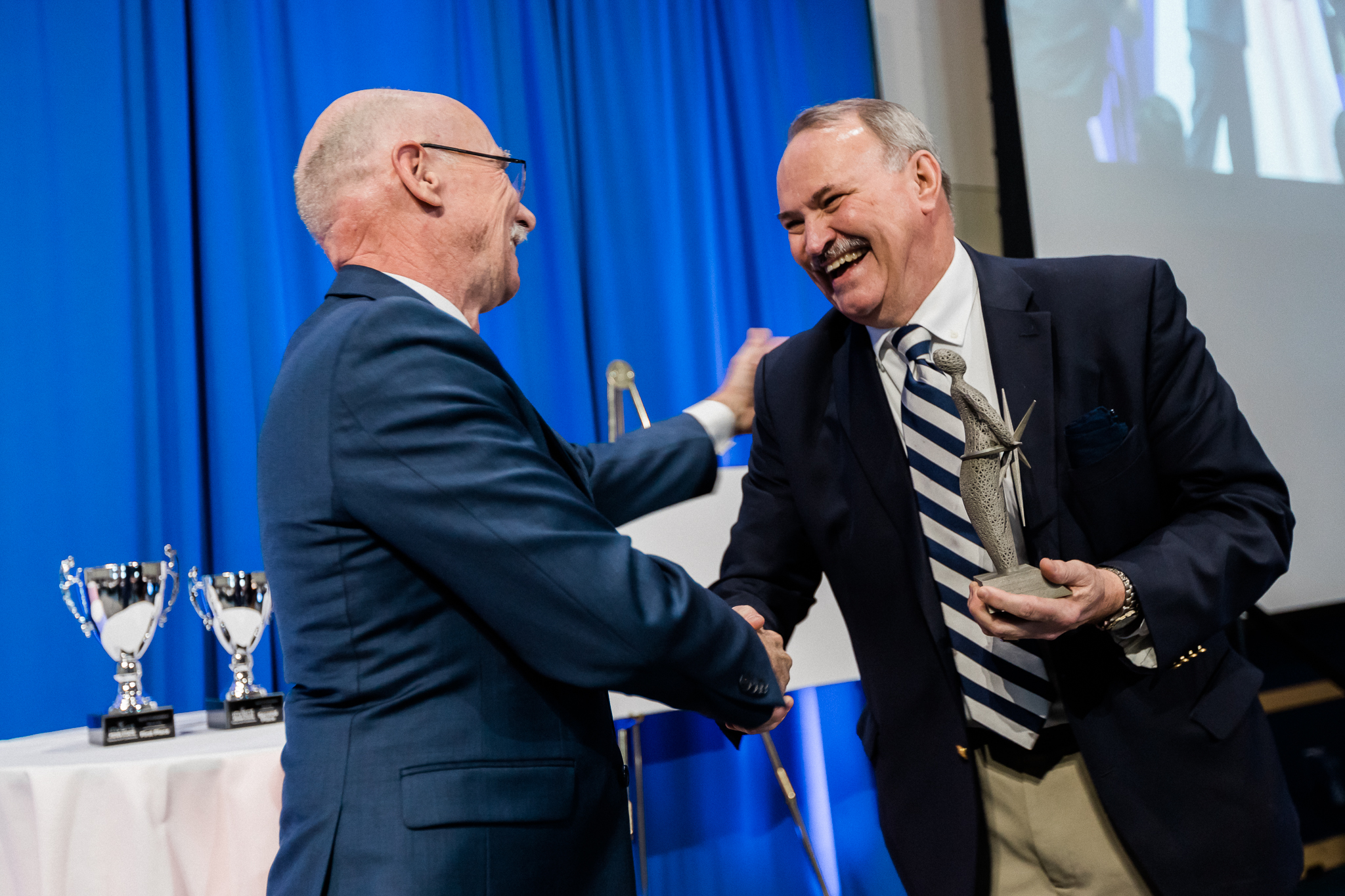 Dr. James Adair receives the Invent Penn State Inventor of the Year award from Vice President for Research Neil Sharkey