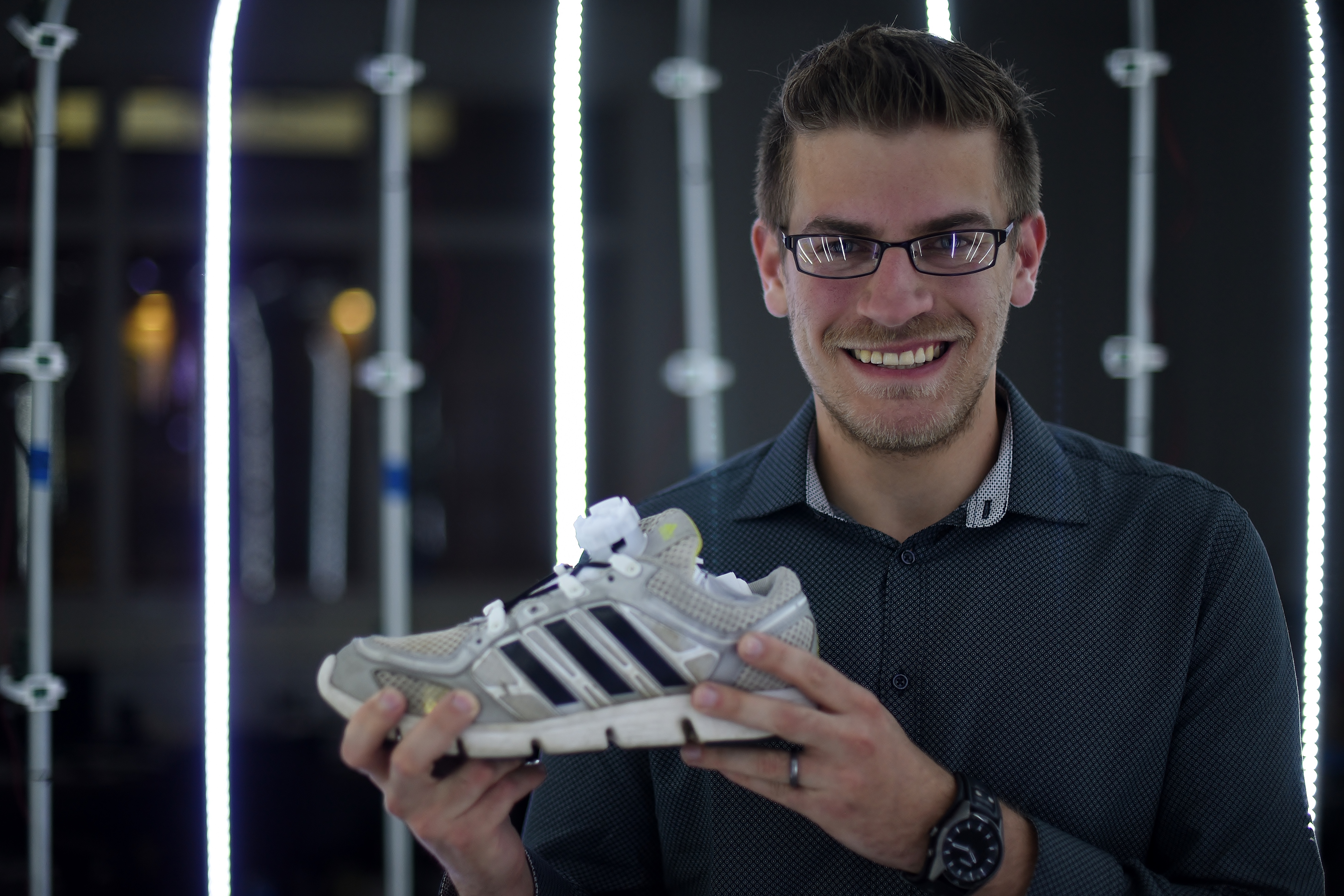 A portrait of Penn State Behrend alumnus Wes Hall, with the Lace-N-Lock device.