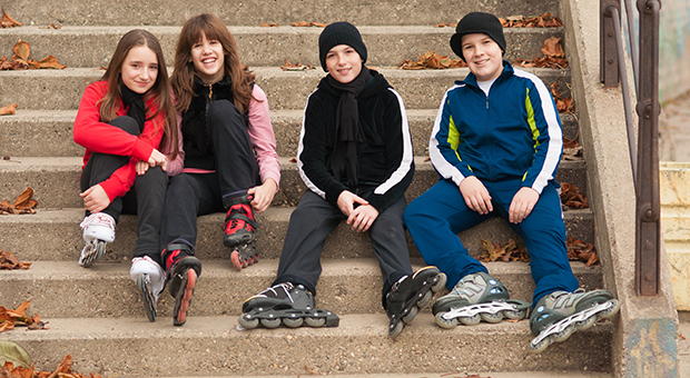 Four children sitting on steps