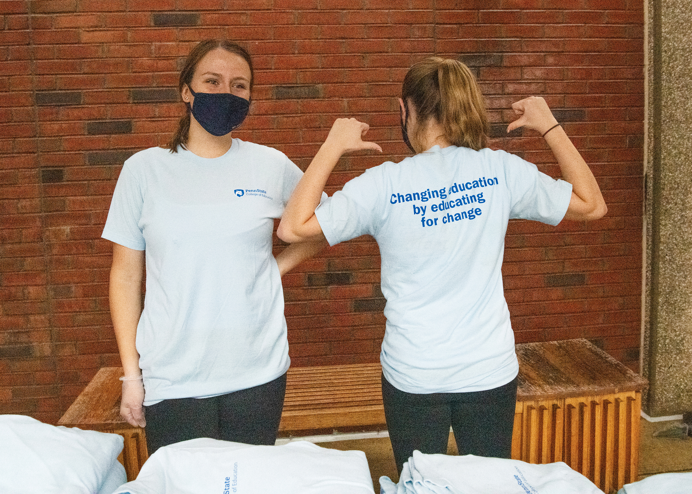 Members of the College of Education Student Council model T-shirts that were handed out during a grab-n-go cookies and cocoa event last fall.