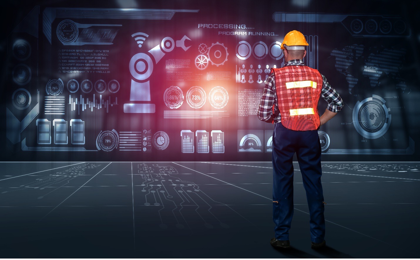 Construction worker looking at a wall of gears