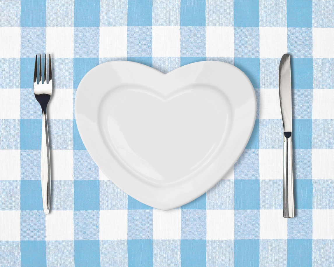 A heart-shaped plate with a fork and knife.