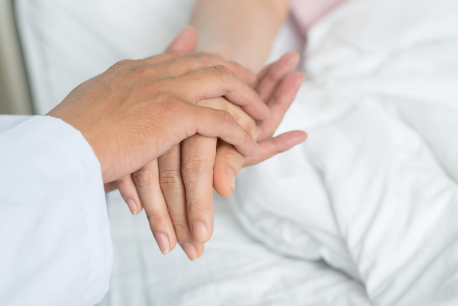 Nurse consoling patient