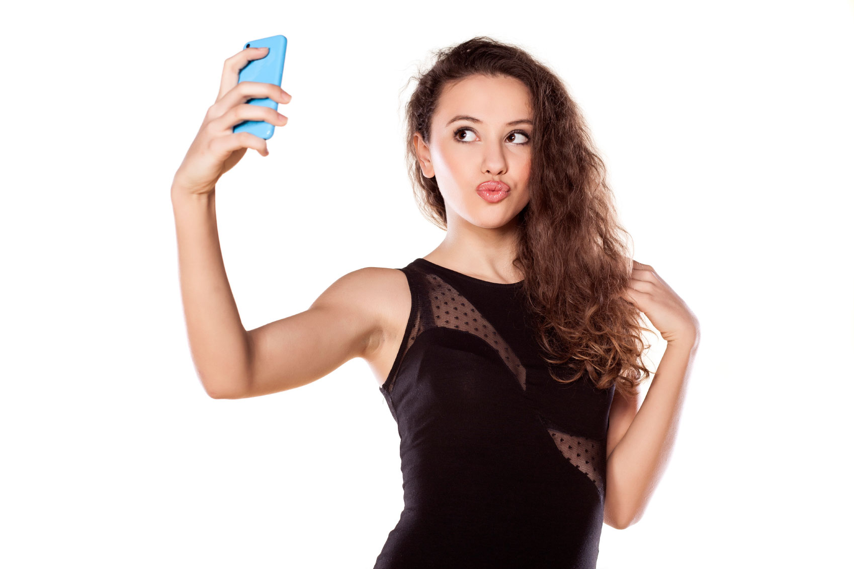 pretty teen girl taking selfies with her smart phone