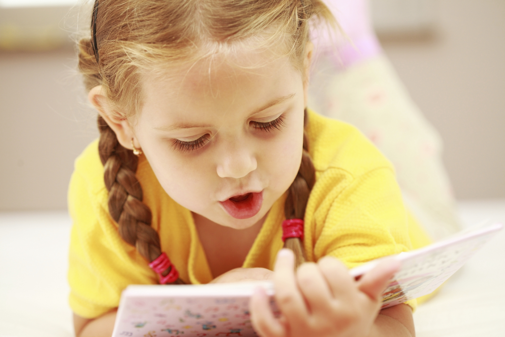 toddler reading book aloud