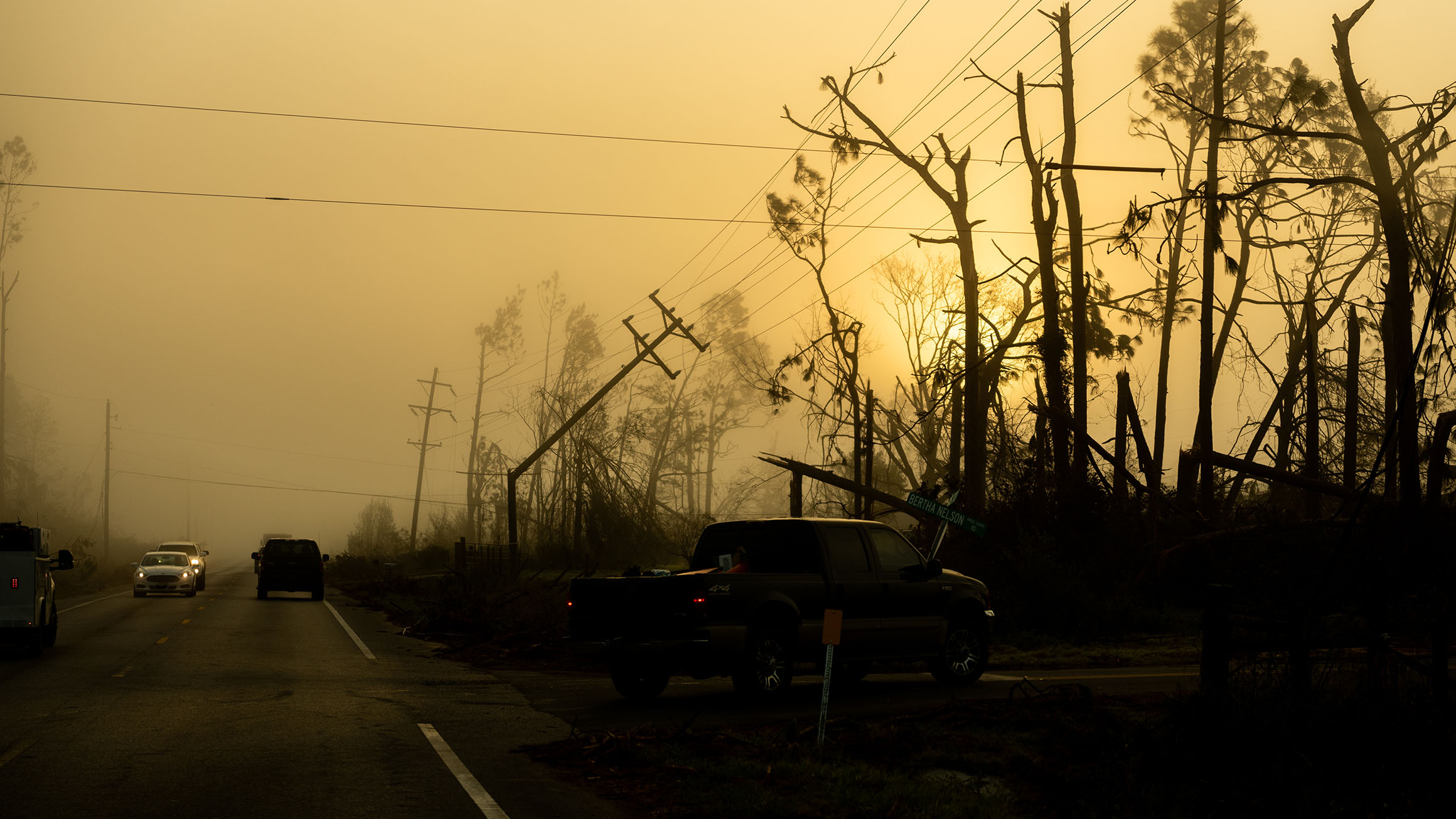 Power lines are shown downed from winds