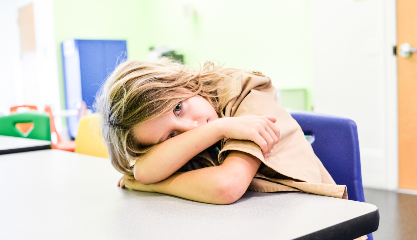 sad child at desk