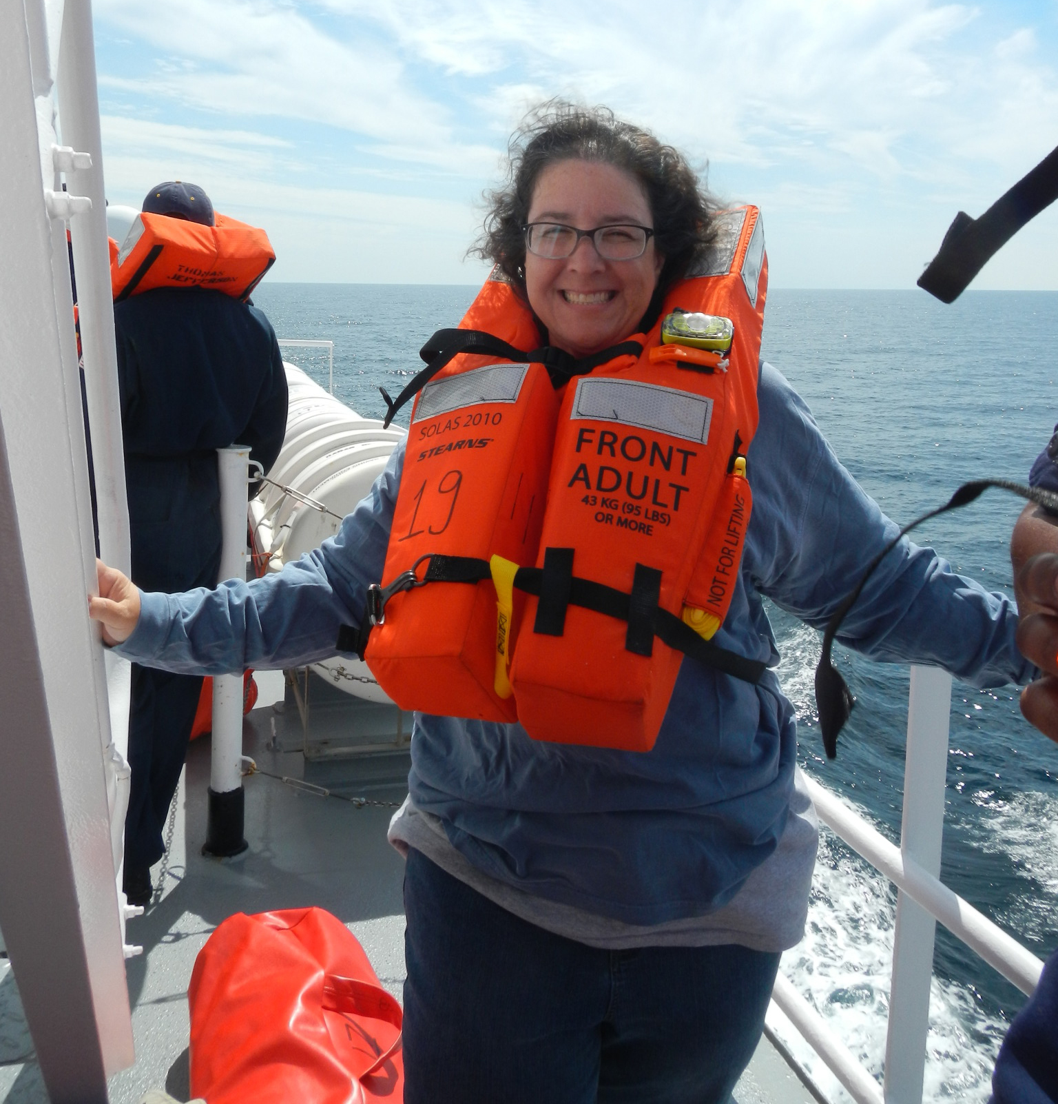 Laura Guertin in a life vest on the ship