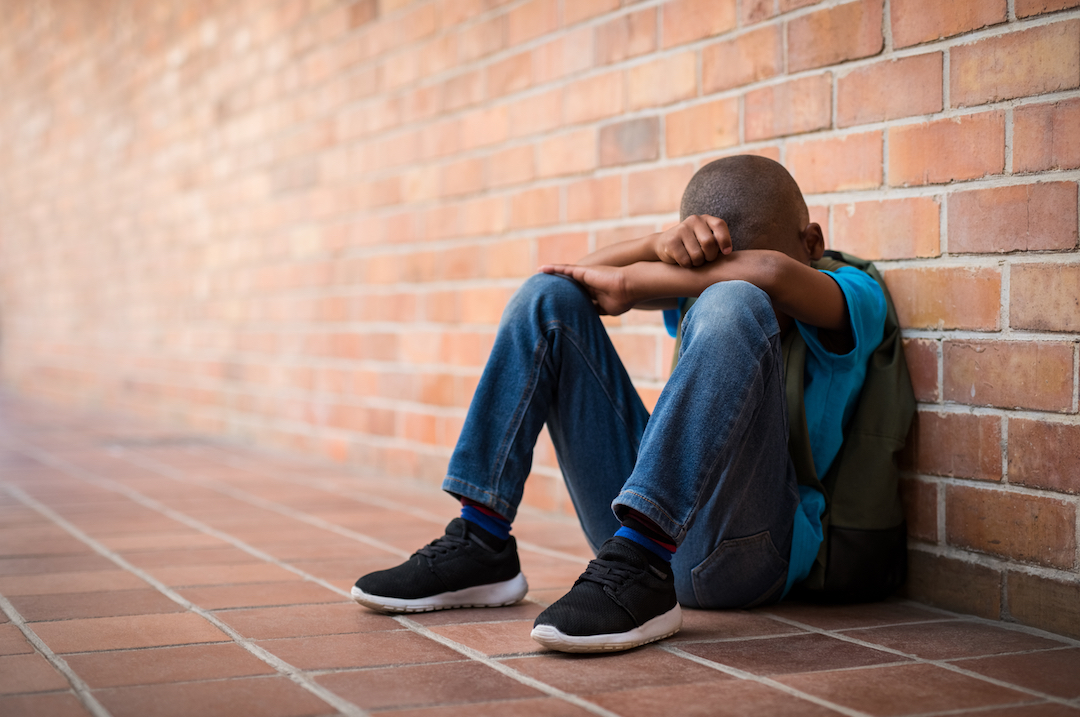 Young boy in trouble at school