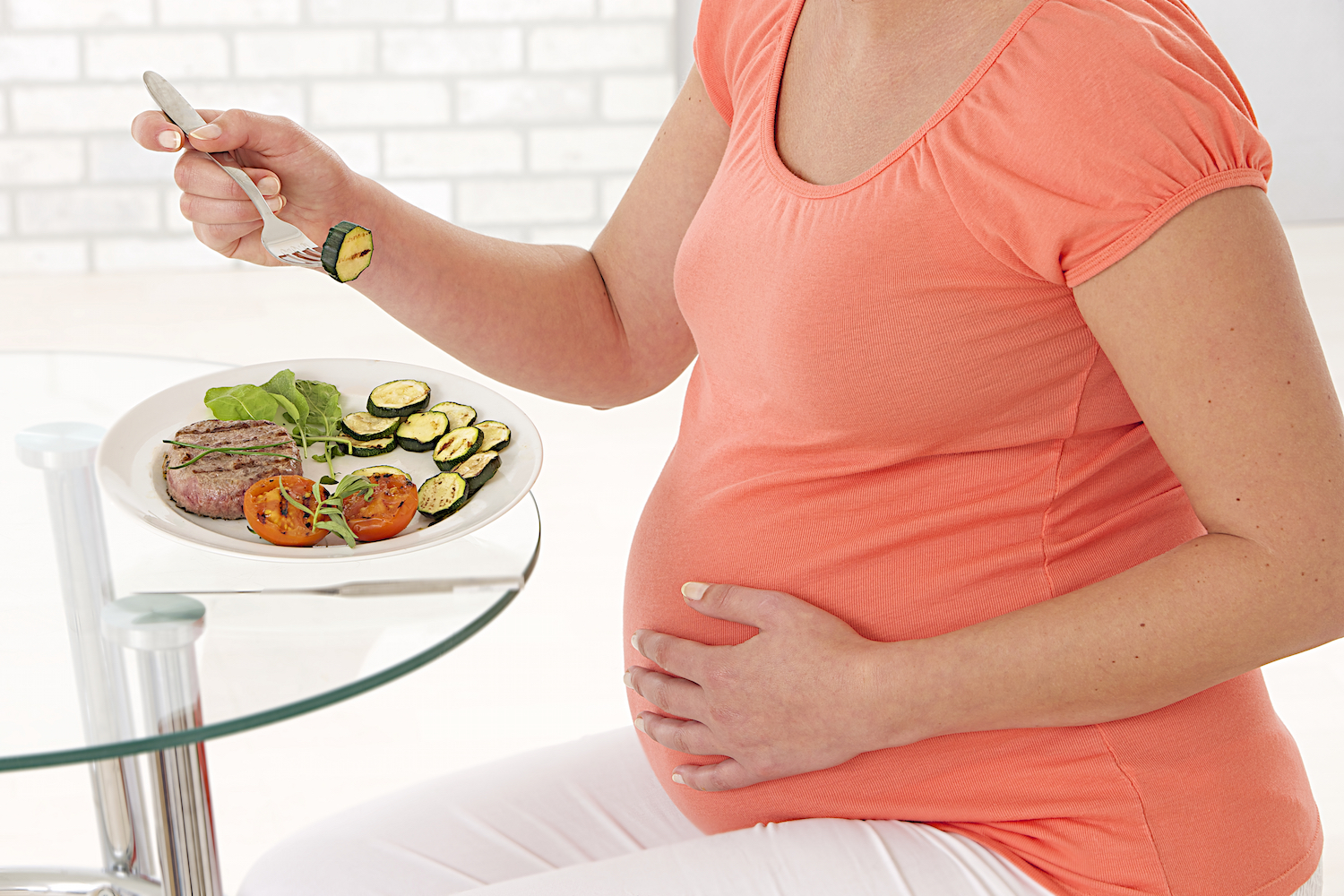 Pregnant woman eating healthy food