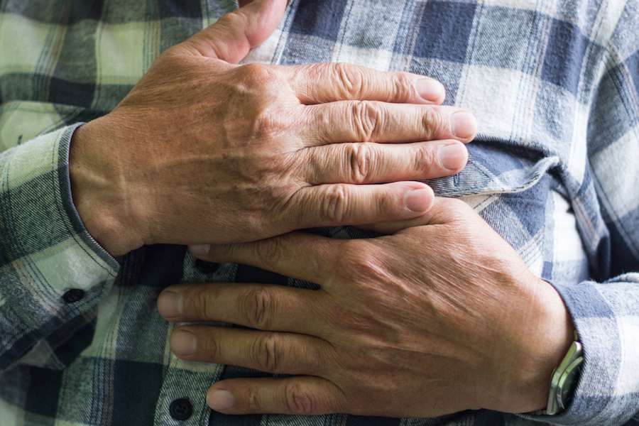 Man clutching his chest