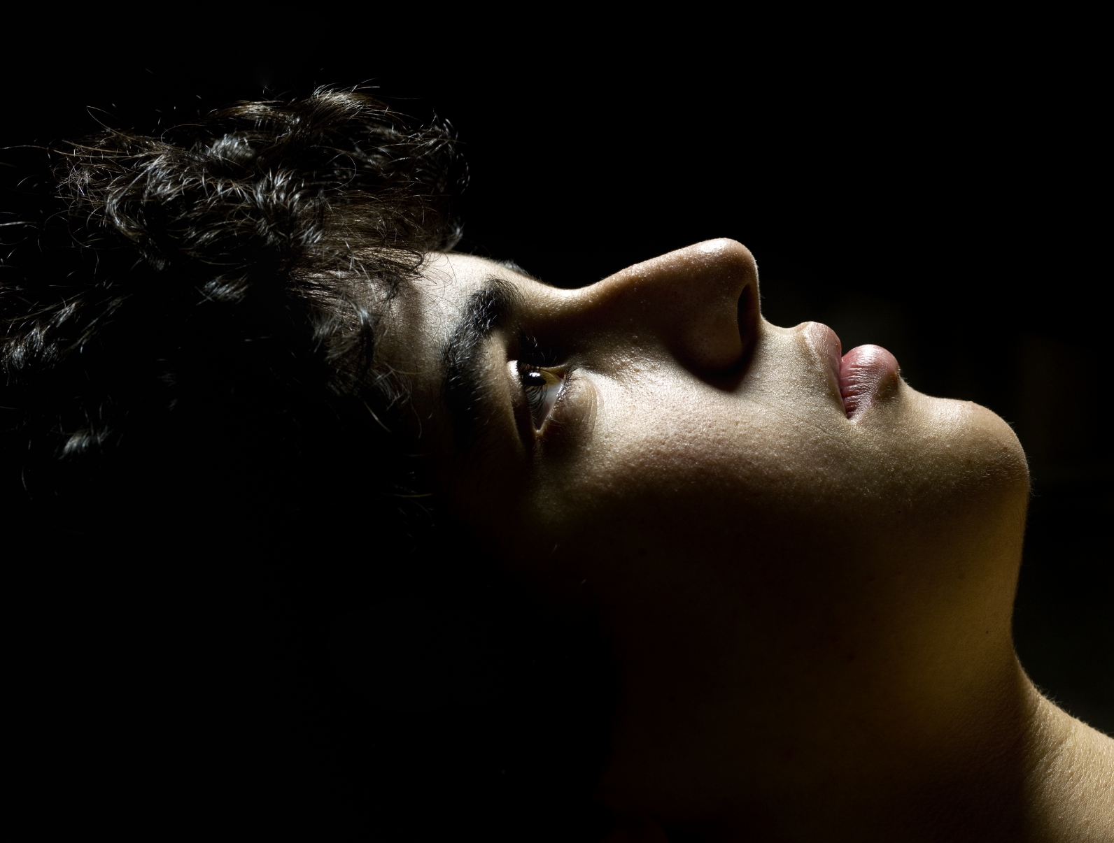 boy profile dark background