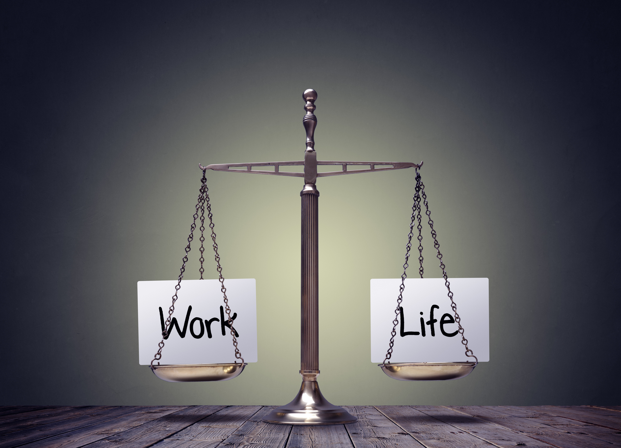 A scale with "work" on one side and "life" on the other