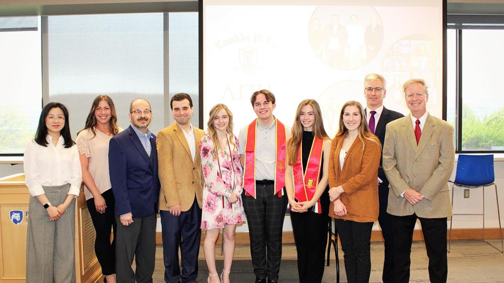 Lambda Pi Eta Honor Society inducts new members, celebrates graduating