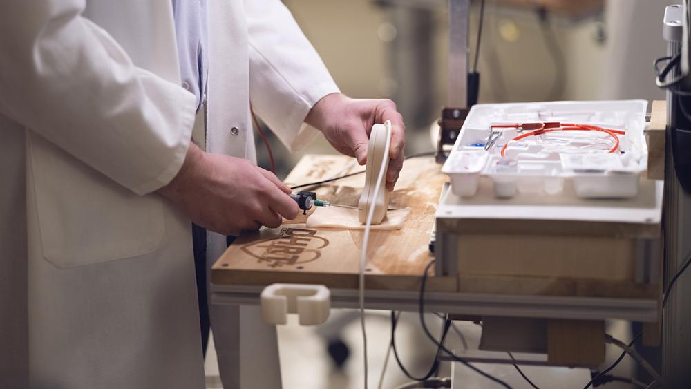 Novel Robotic Training Program Reduces Physician Errors Placing Central