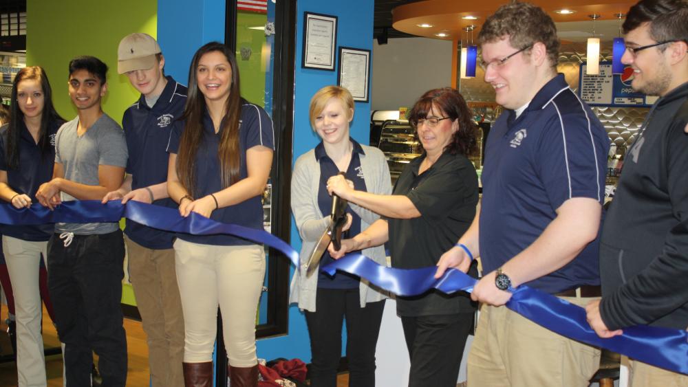 Ribbon cutting marks official opening of new Lion's Den Café, Student ...