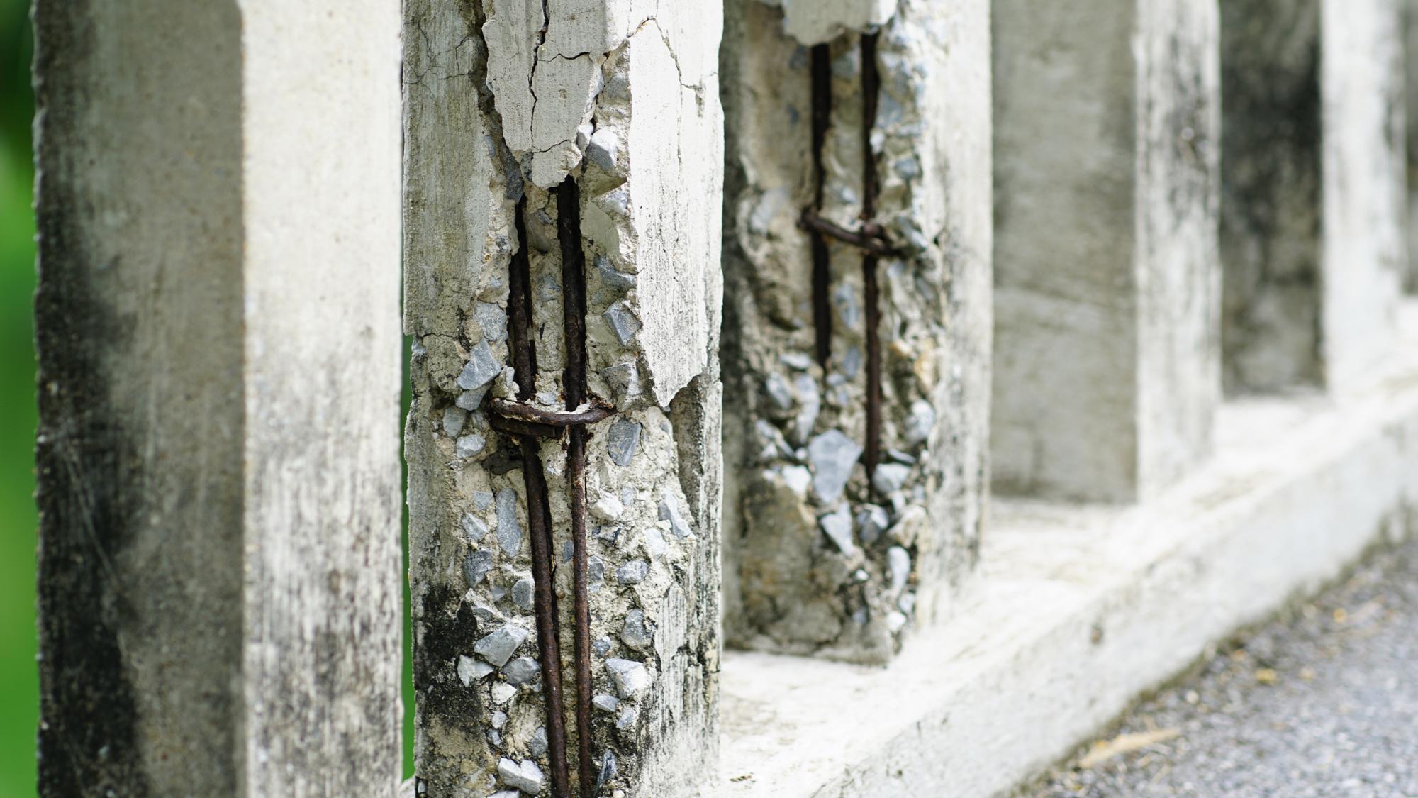 A picture of a concrete bridge deteriorating over time.