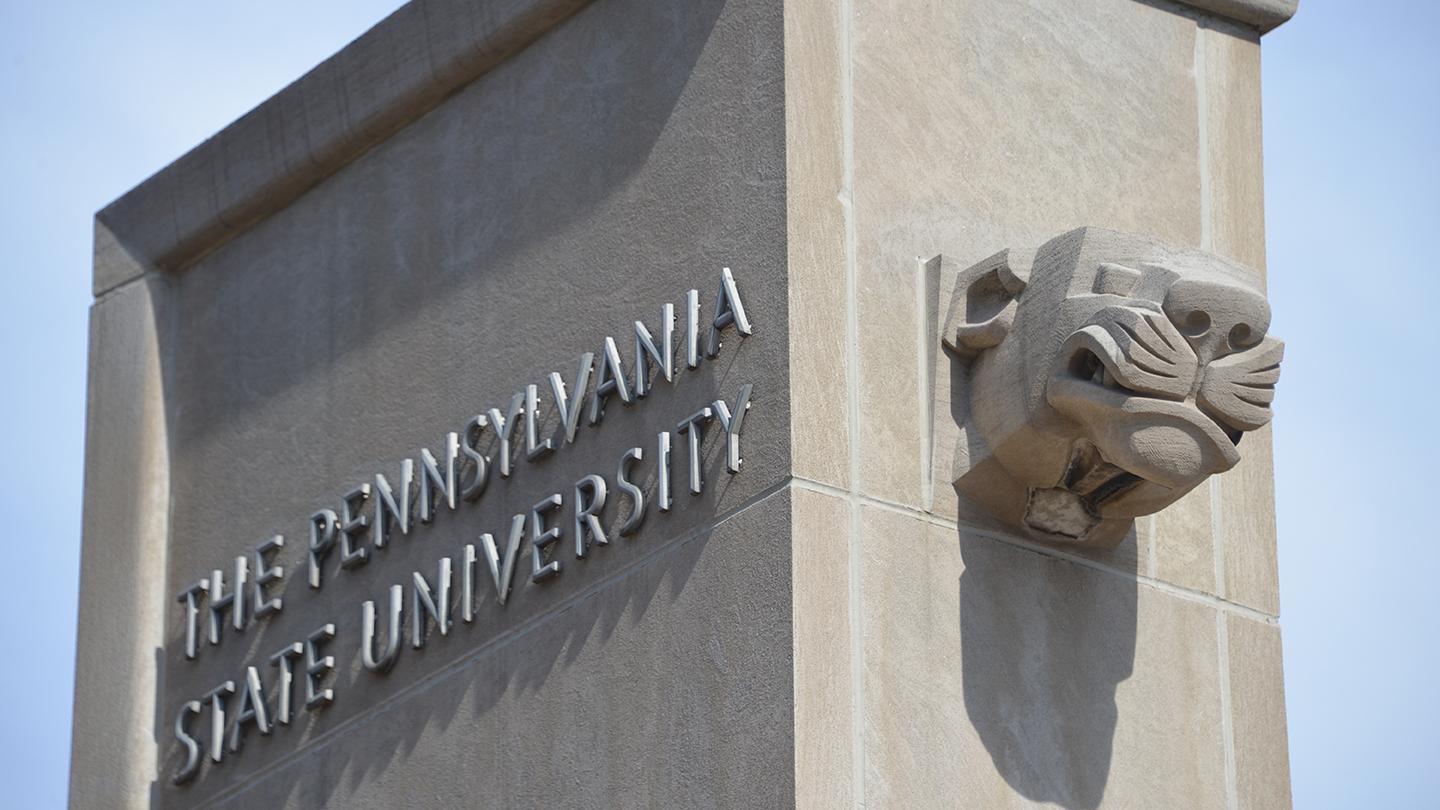 Close up of Pollock Gates with the lion's head on one side and The Pennsylvania State University on the other