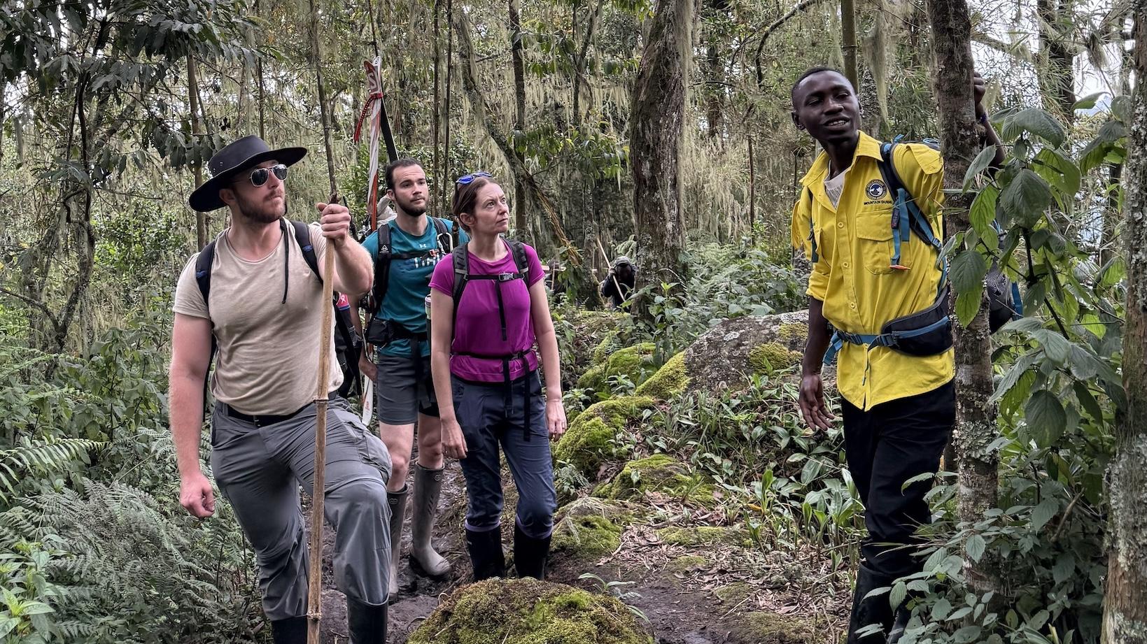 A group of collaborators including Penn State faculty member Sarah Ivory, center, is photographed on the second day of a three-day trek near Kilembe village, Uganda, on June 26, 2025.