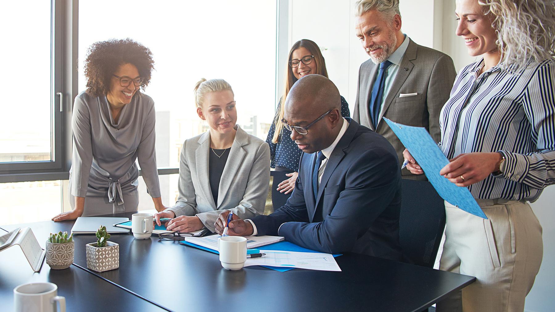 People gathered around a desk